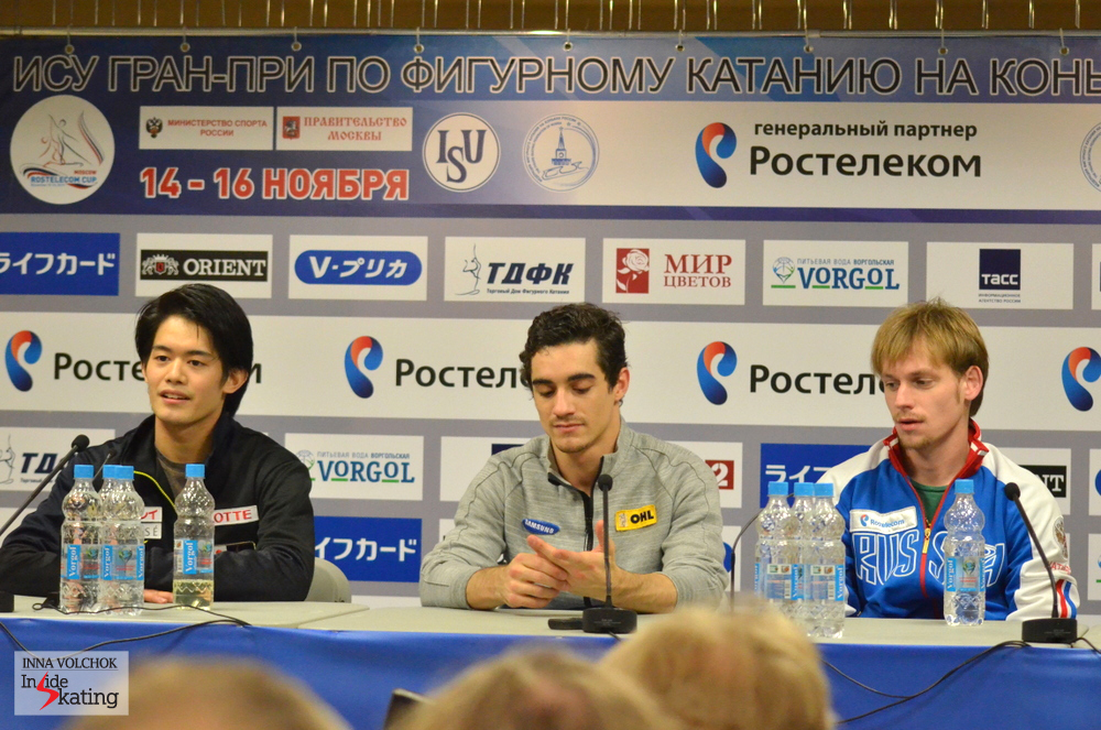 The winners of the short program in the men's event at the press conference in Moscow