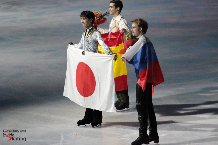 The winners and their flags: Yuzuru Hanyu (Japan), Javier Fernandez (Spain), Sergei Voronov (Russia)