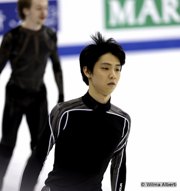 A very-focused Yuzuru Hanyu during practice – of course, he had come to Shanghai to defend his World title; in the end, as we all know, it was his team mate who won the gold. Still, the 20-year-old Japanese had a magnificent set of programs during 2014-2015 season – and I’ll mostly emphasize the short one: skating to Chopin’s Ballade no. 1, Yuzuru was one with the music. 