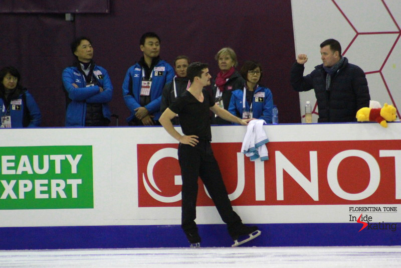 Javier Fernandez at the boards, talking to Brian Orser