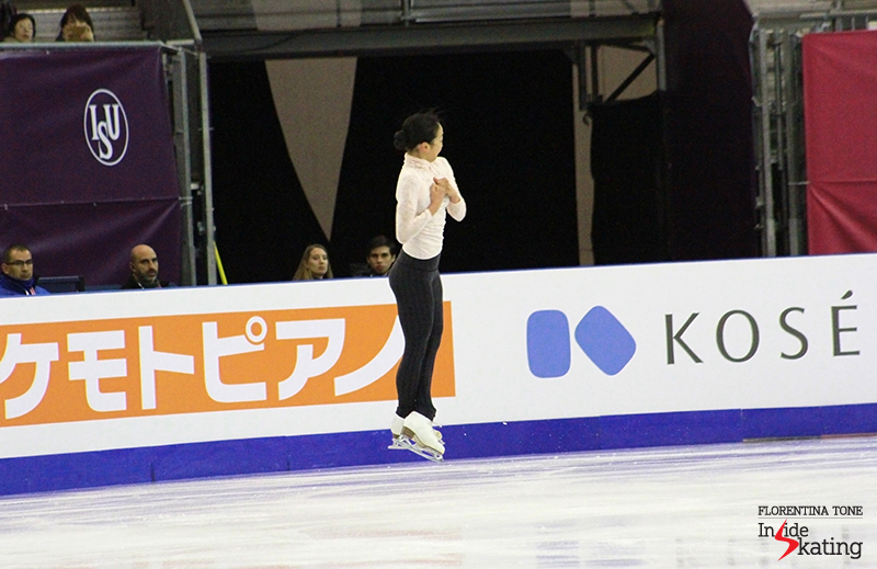 In the air, during her trademark jump: the triple Axel