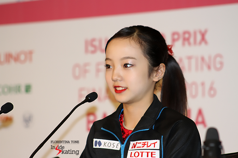 The 14-year-old bronze medalist, Marin Honda, listening to the journalists' questions
