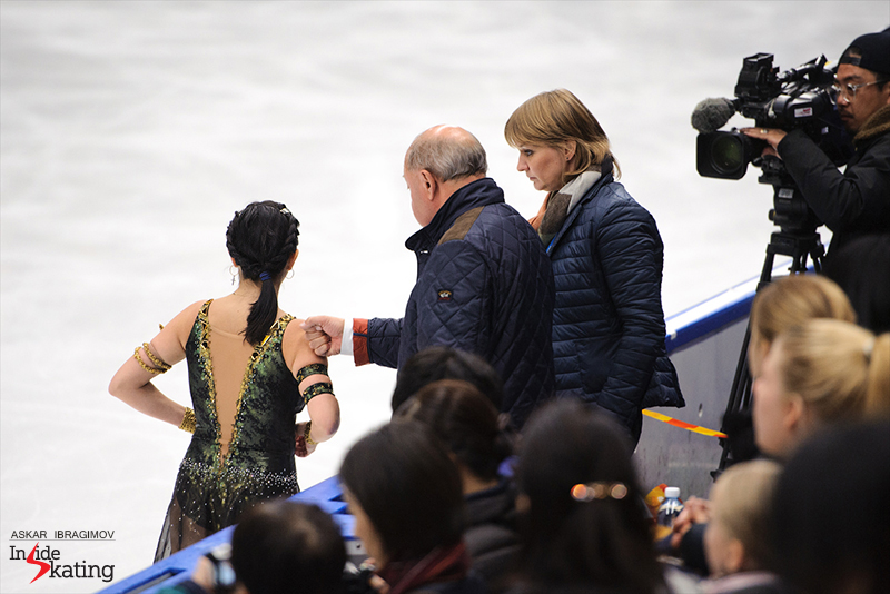 Alexei Mishin and Tatiana Prokofieva alongside Elizaveta: final words of encouragement before she takes the ice for her “Cleapatra” free skate in Espoo, at 2016 Finlandia Trophy